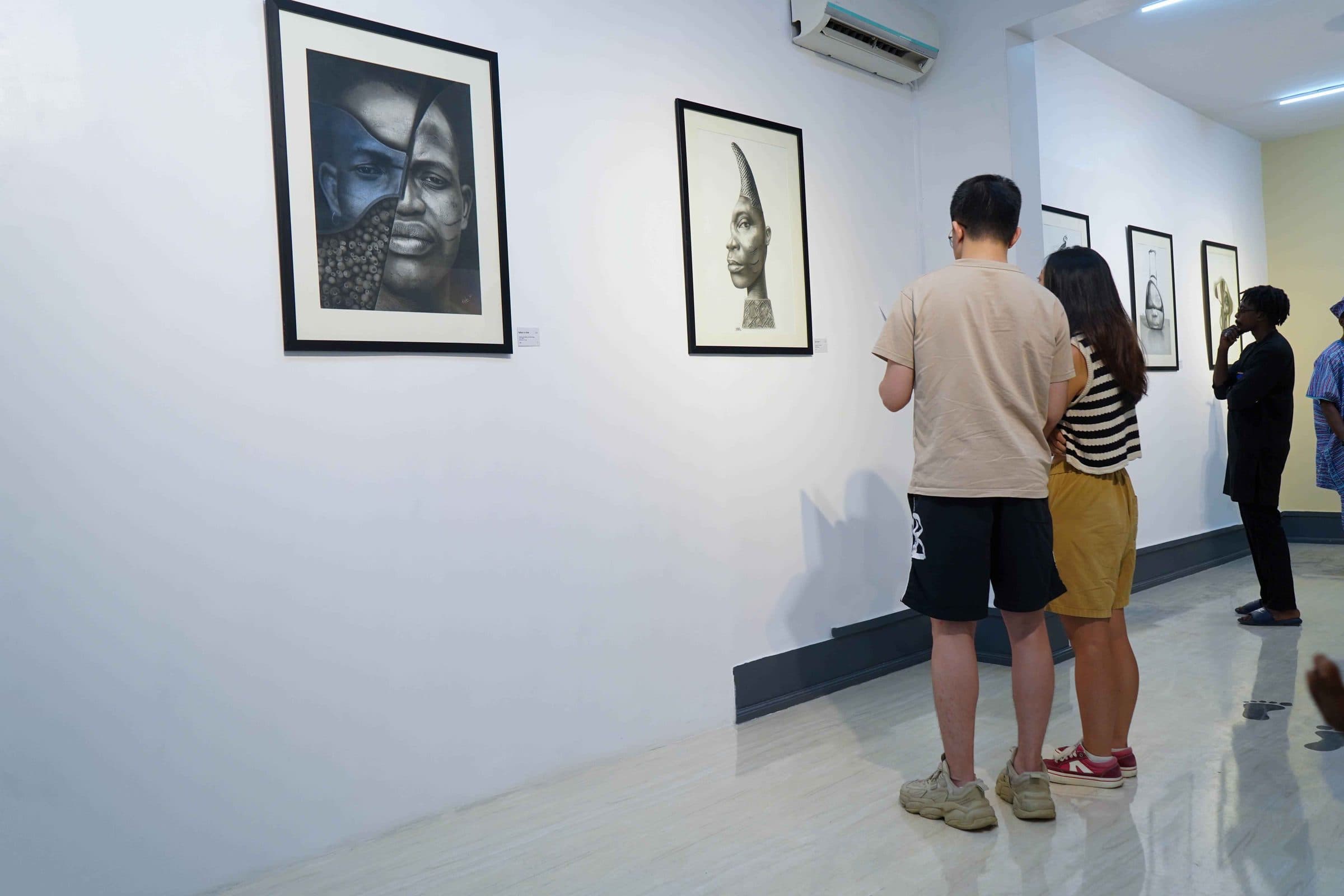 Visitors walk through the exhibition
